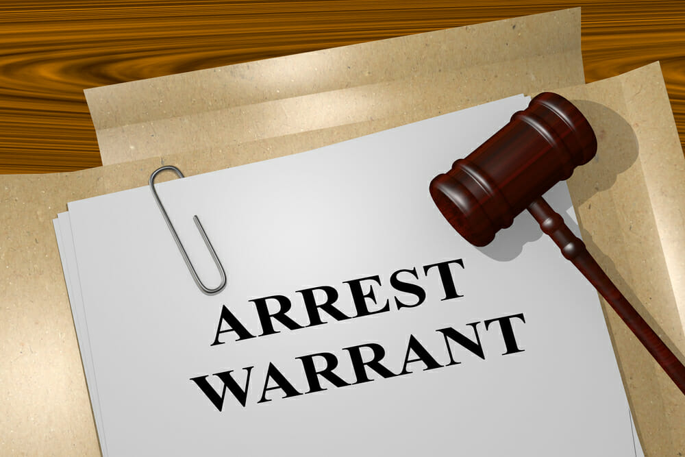 do warrants show up on a background check